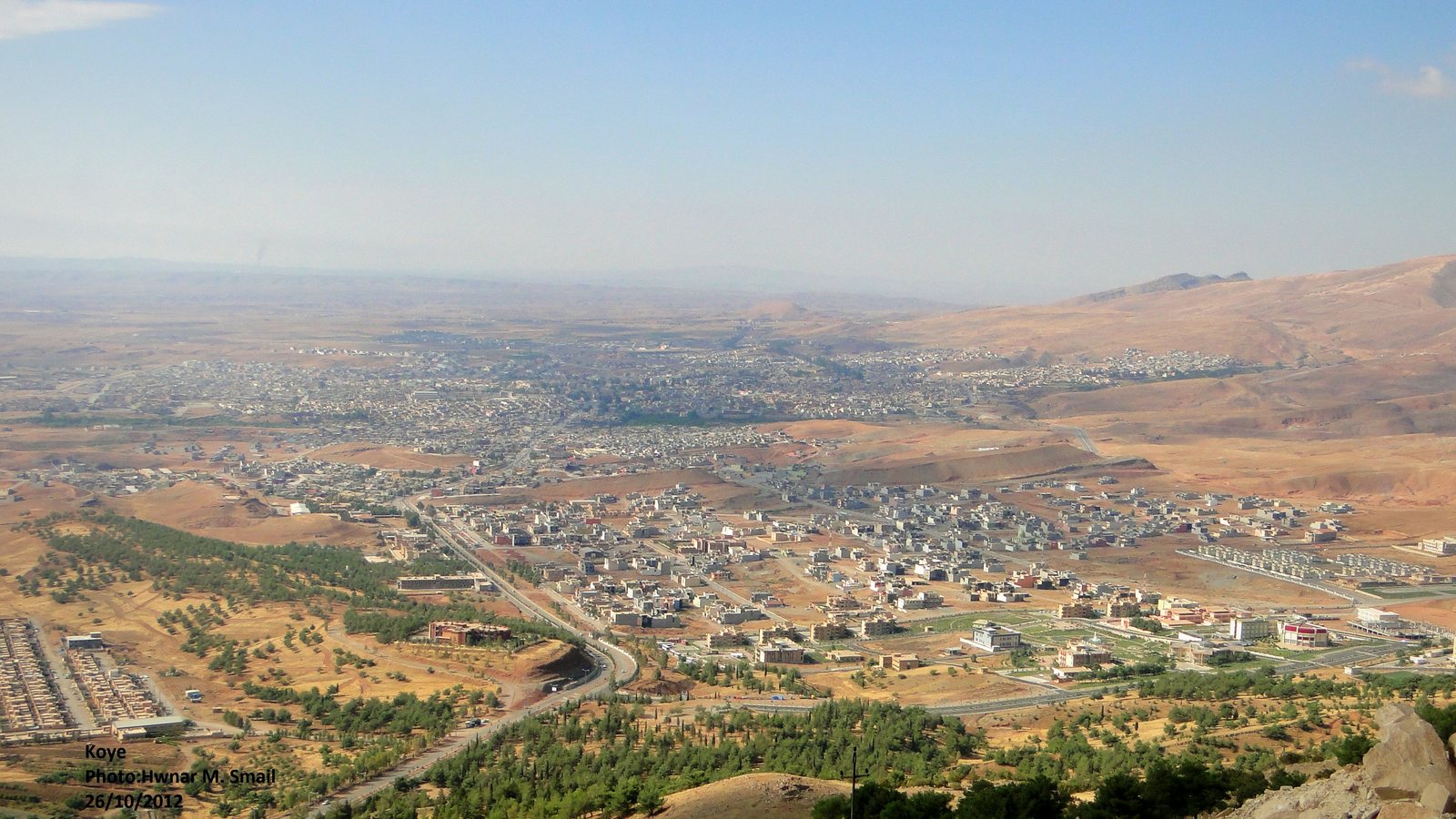 Jewish Cemetery of Koy Sanjaq — City context: Koy Sanjaq / Koye and its surrounding hills. The photograph situates the Jewish neighborhood and cemetery records within the wider town.